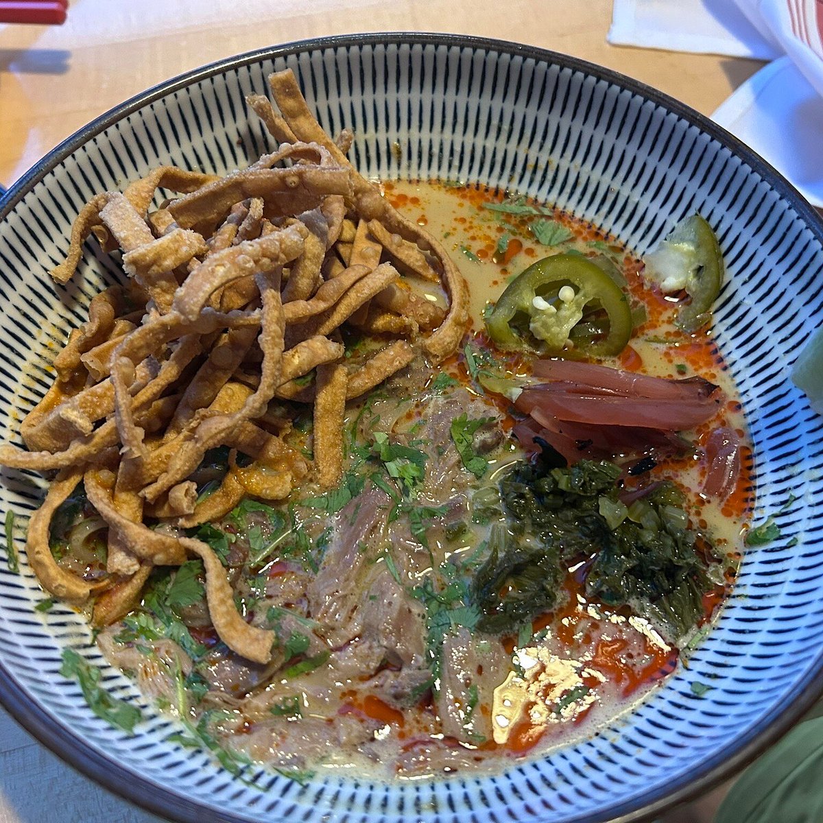 The Honey Paw signature dishes Khao Soi, Lobster Toast, Smoked Lamb Kebab, Dolsot Bibimbap